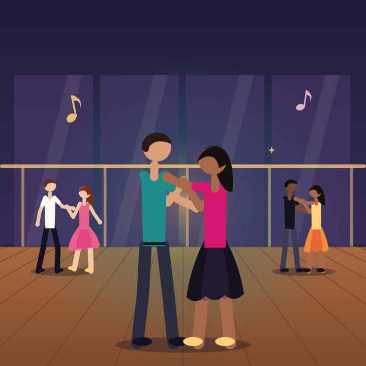 Beginner bachata class in Montreal: a couple in closed hold in front of the studio mirrors