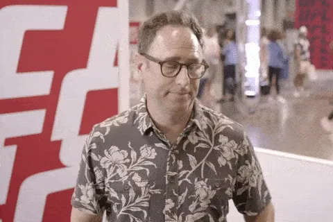Man in a floral shirt looking worried