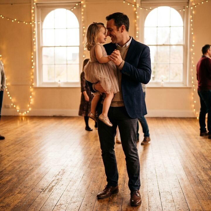 Father and daughter dancing together in heartwarming moment
