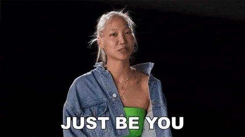 Woman in a denim jacket with the caption Just be you
